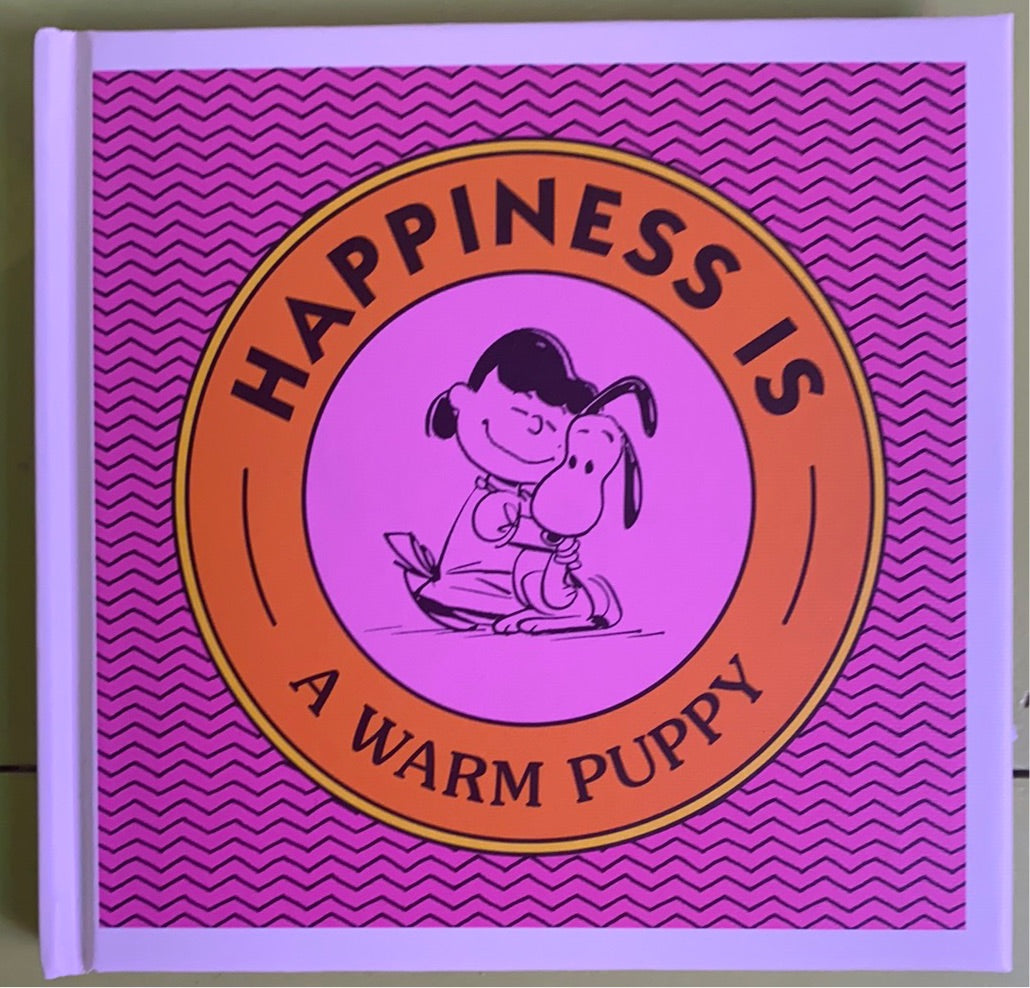 Happiness is a warm puppy, Charles M. Schulz